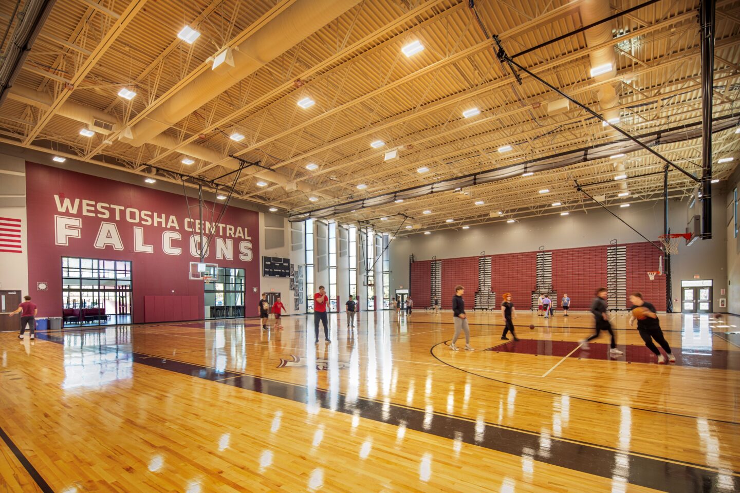Competition gym at Westosha Central HS with students playing basketball