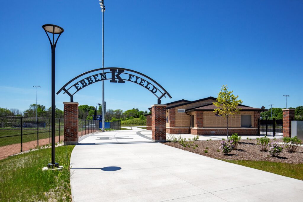 Main entrance to Ebben Field with welcome sign and concession stand building