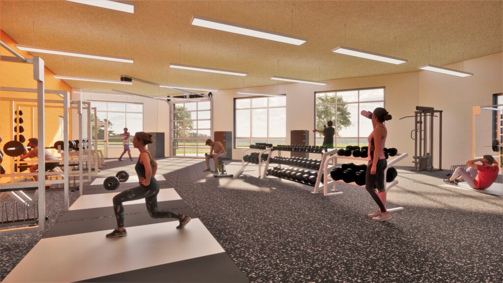 Weight room with large windows for natural light and a garage door